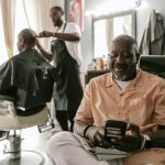 a man sitting on a barber chair