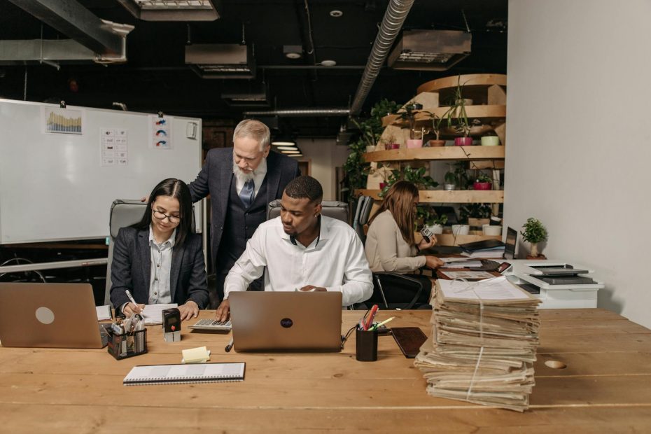 four people working in the office