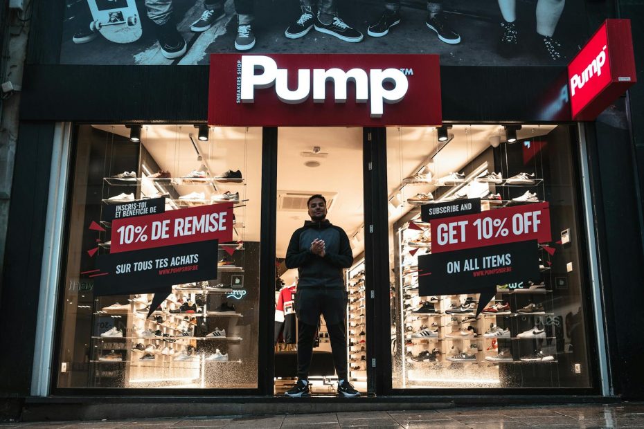 man standing at the doorway of pump shop
